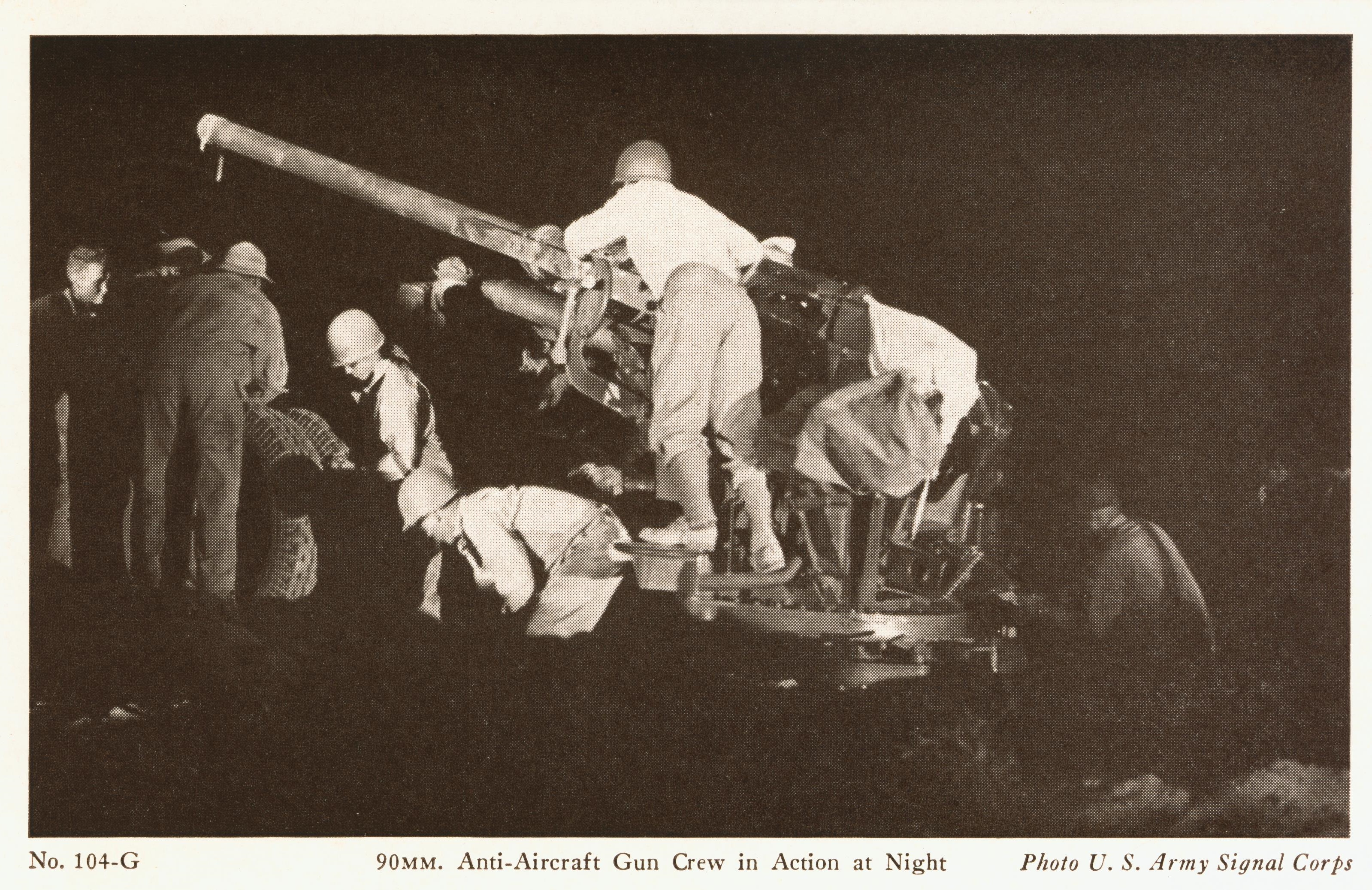90 mm anti-aircraft gun and crew at night
