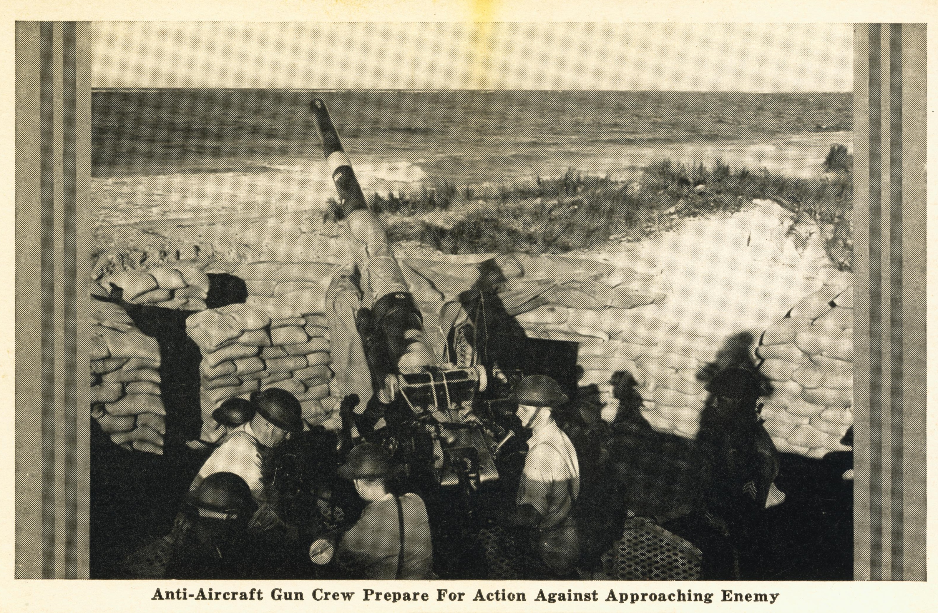 Anti-aircraft gun and crew prepare for action against approaching enemy