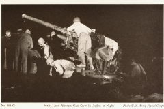 90 mm anti-aircraft gun and crew at night