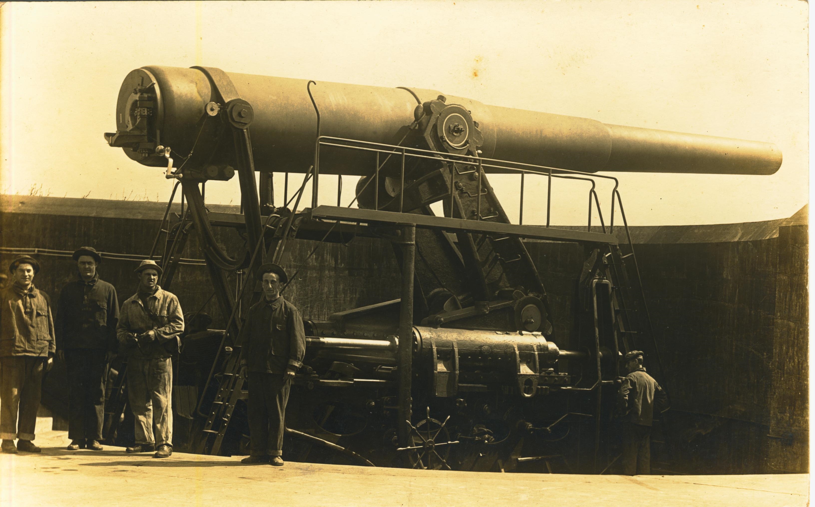 Men and disappearing gun