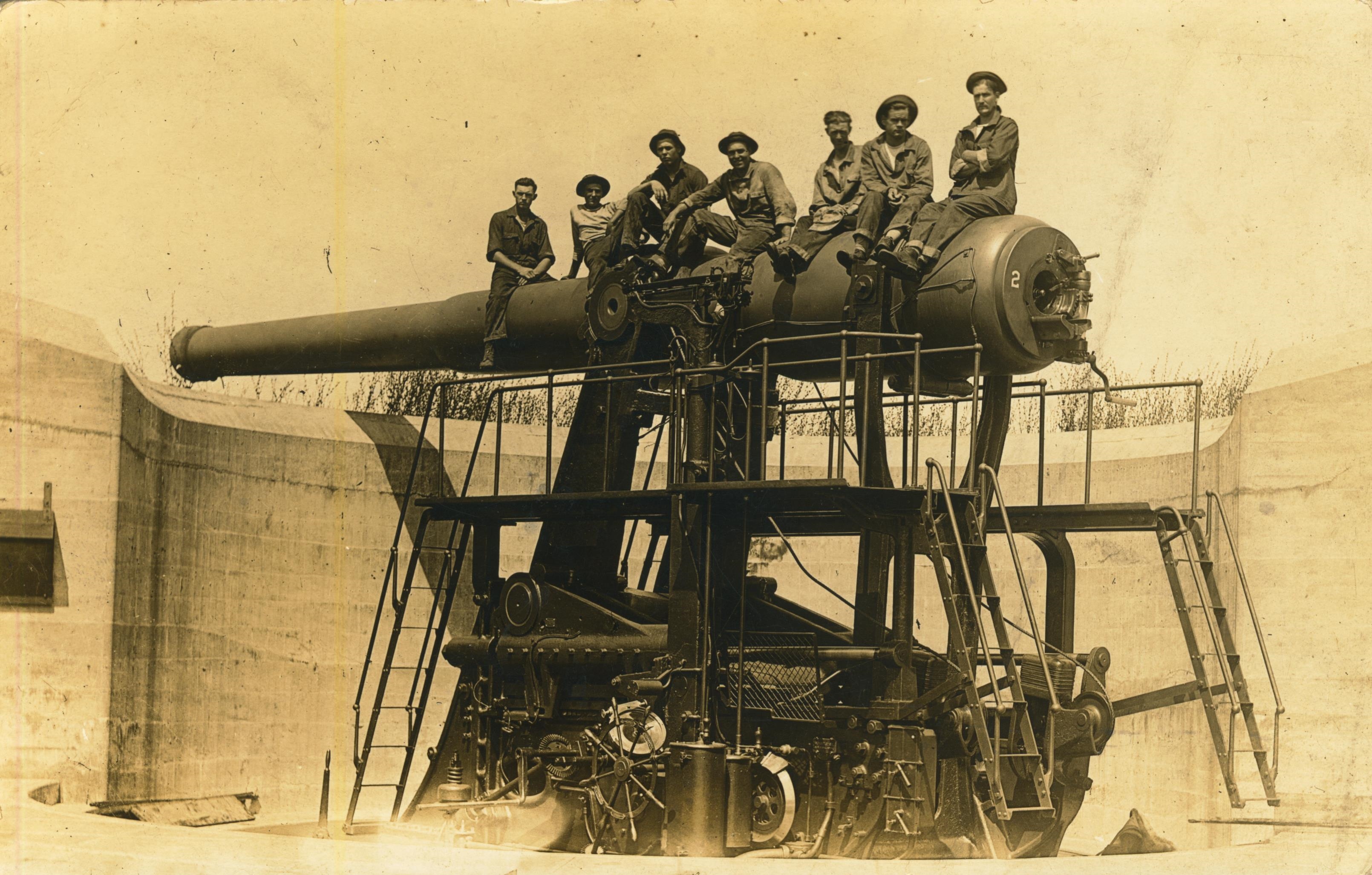 Men on disappearing gun