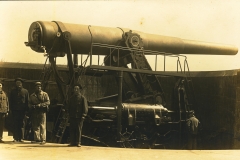 Men and disappearing gun