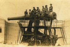 Men on disappearing gun