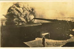 Twelve inch gun in action showing projectile
