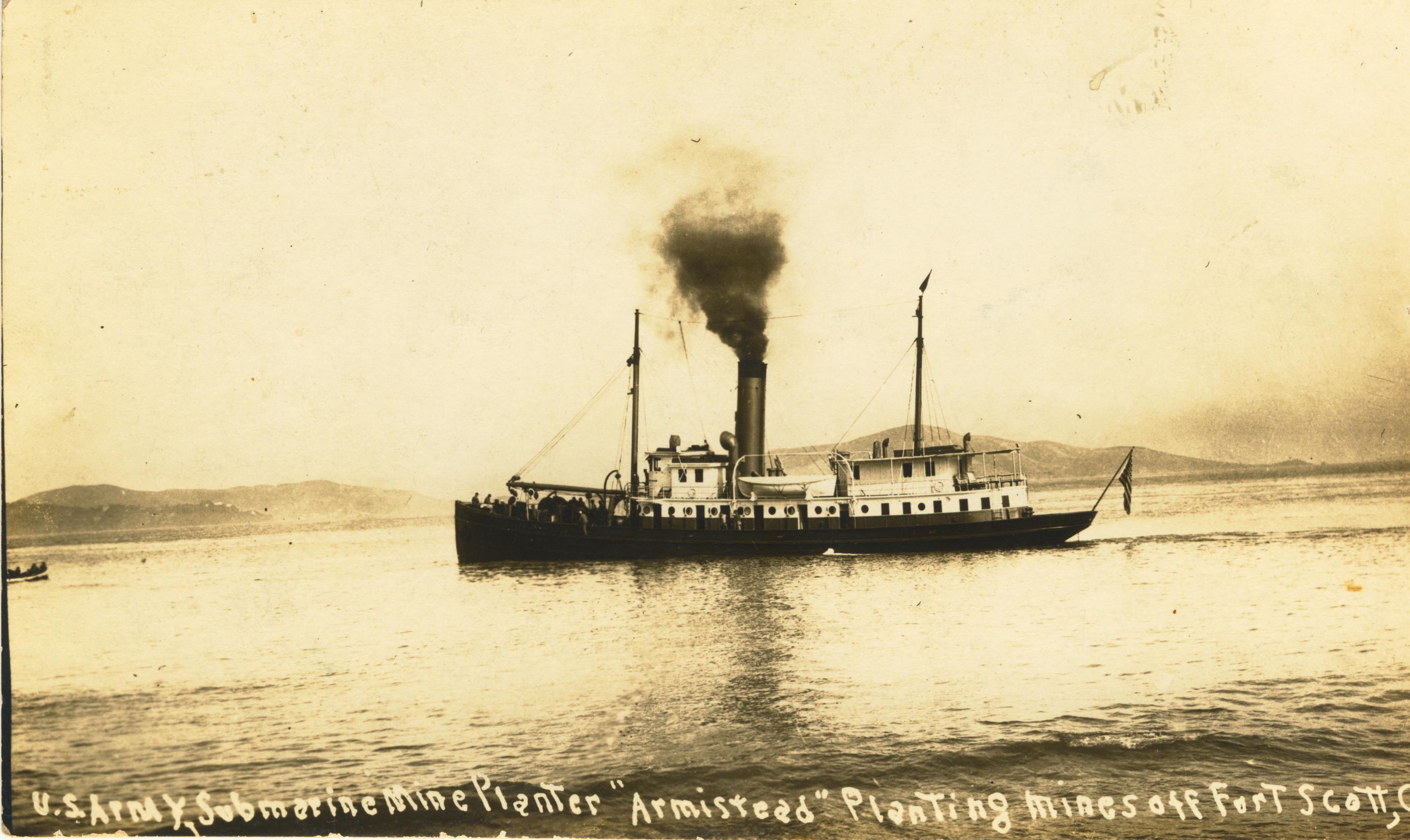 U.S. Army submine mine planter Armistead planting mines off Fort Scott CA.