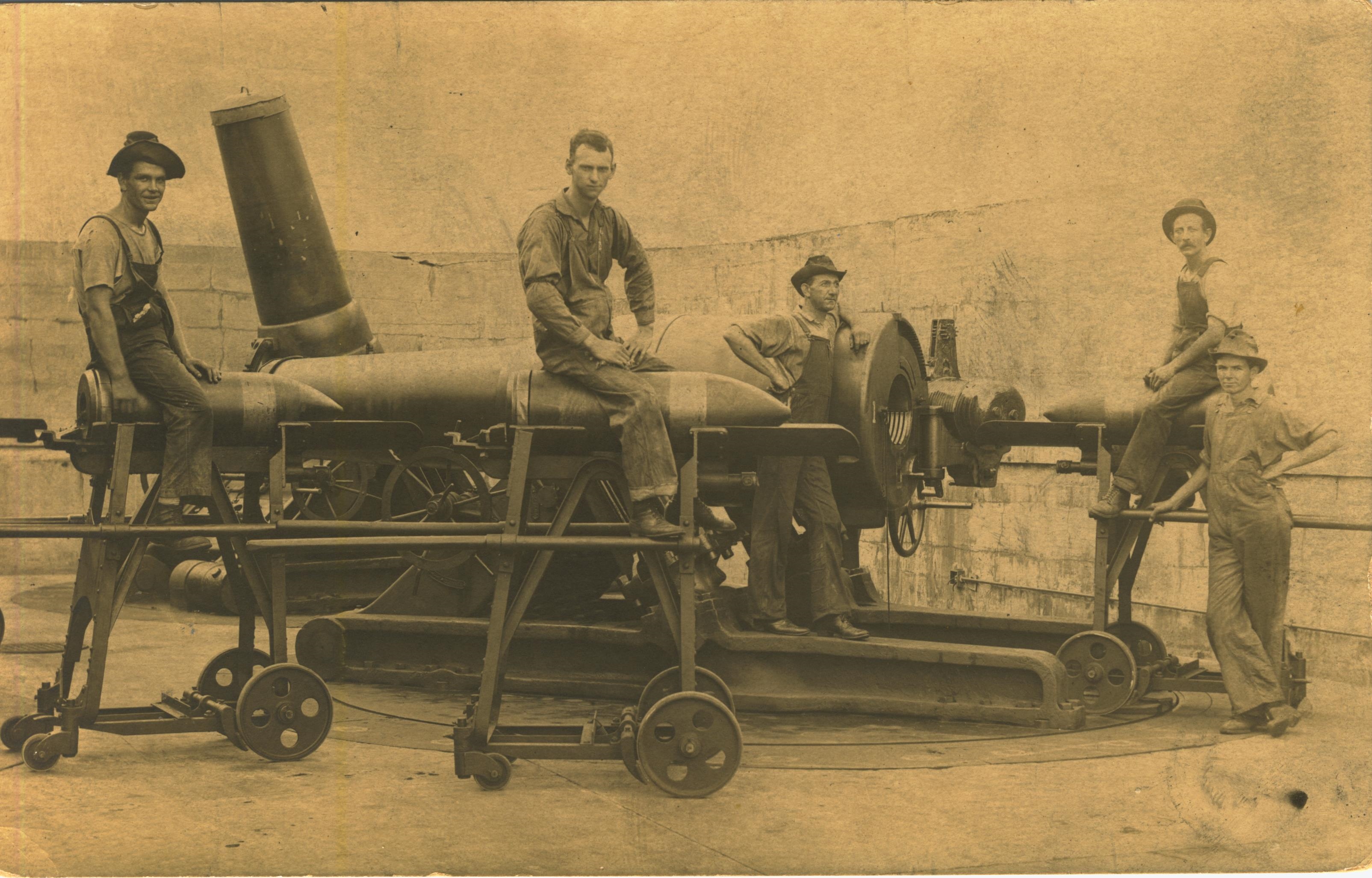 Soldiers sitting on shells
