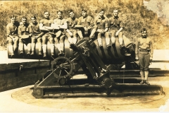 Soldiers sitting on mortar