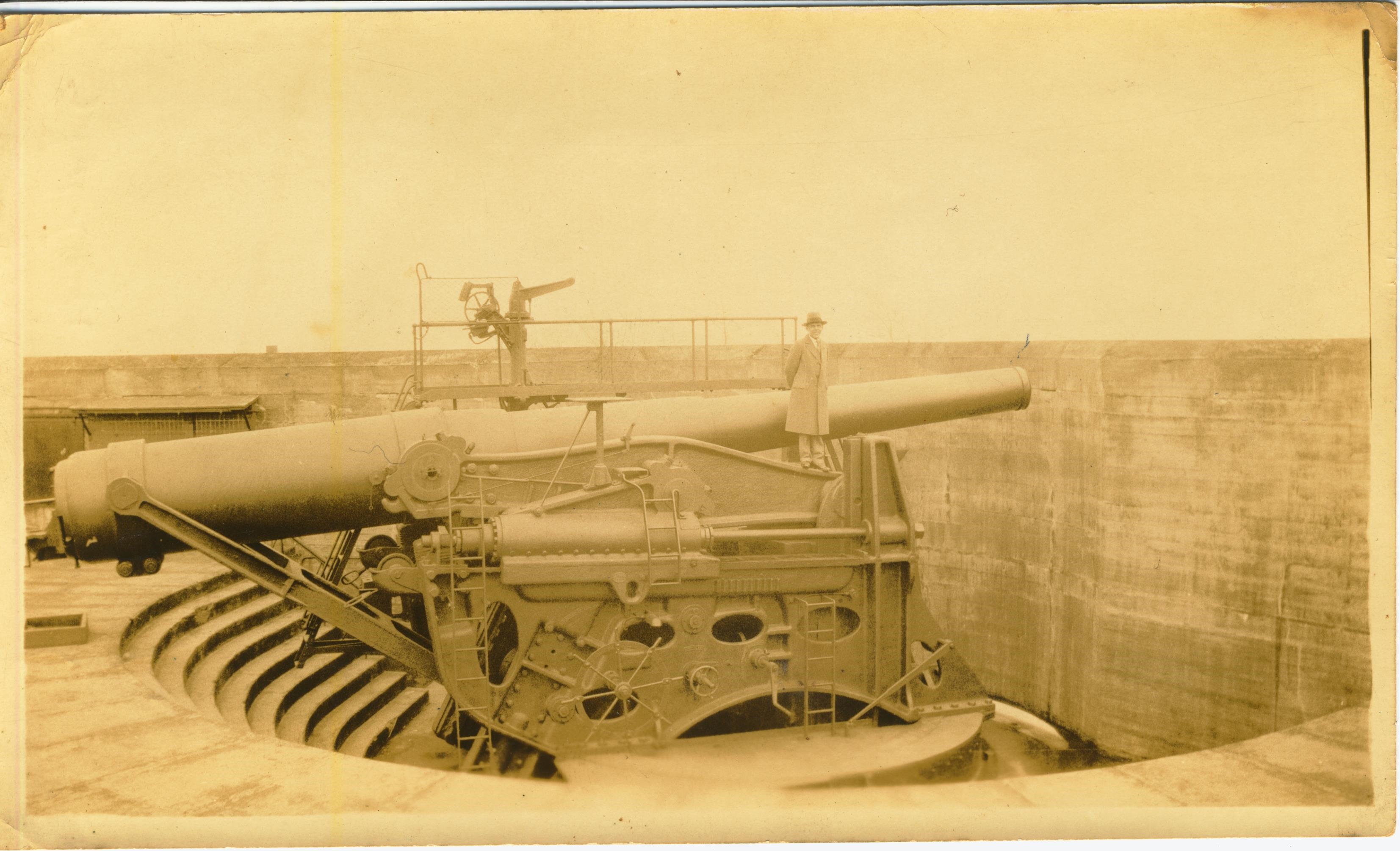 Man on disappearing gun Staten Island written on back