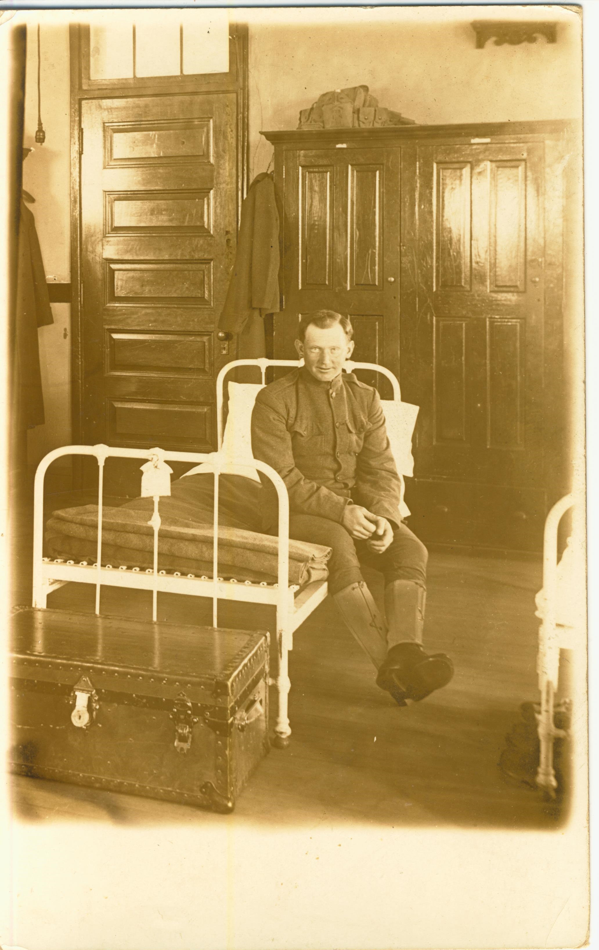 Soldier on Bunk photo likely taken at Fort Terry NY