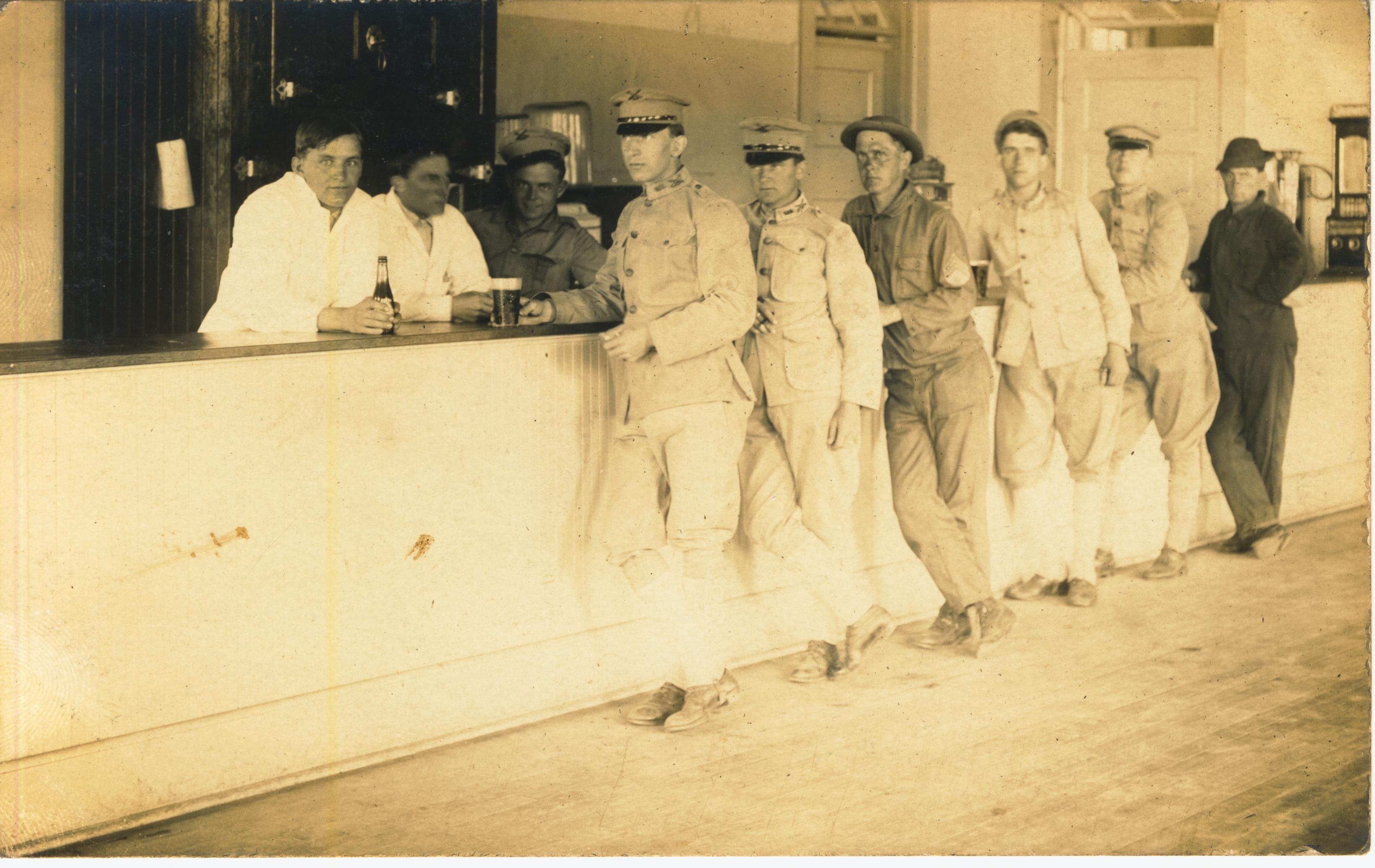 Soldiers enjoying a drink photo likely taken at Fort Terry NY