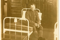 Soldier on Bunk photo likely taken at Fort Terry NY