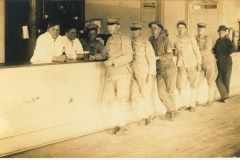 Soldiers enjoying a drink photo likely taken at Fort Terry NY
